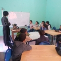 Marwa at the front of a classroom of children
