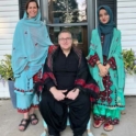 Sahar and host parents wearing traditional dresses from Pakistan. 