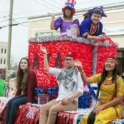 Mirsela waves from a parade float