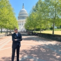 Sayed in a suit in front of the U S Capitol
